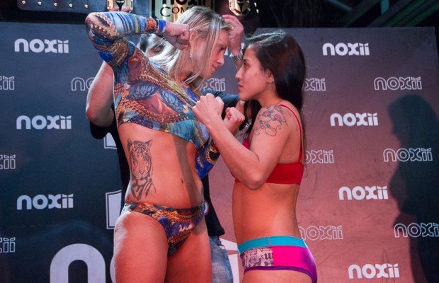 Kinberly Novaes squaring up with her opponent Renata Baldan. Can you see a little pouch in her belly?
