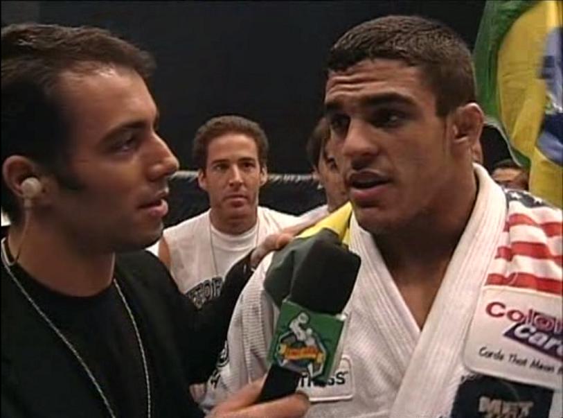 This picture is actually of the UFC debuts of both Joe Rogan and Vitor Belfort.