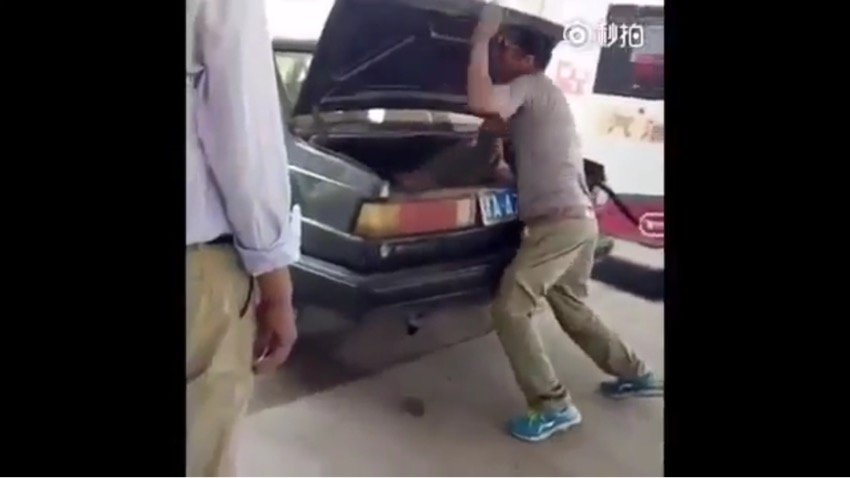 The man was seen forcing his wife into the trunk of the car in China. 