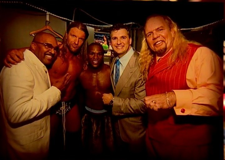 That's Floyd in between Triple H and Shane McMahon and, yeah...they're really big next to regular human beings.