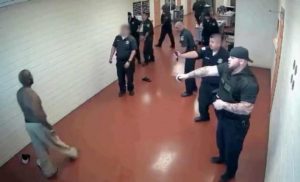 1 inmate fights with 15 Officers