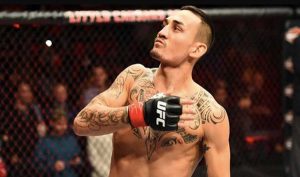 Max Holloway In UFC Octagon Looks Up to The Crowd