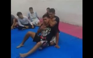 teacher-chokesout-student